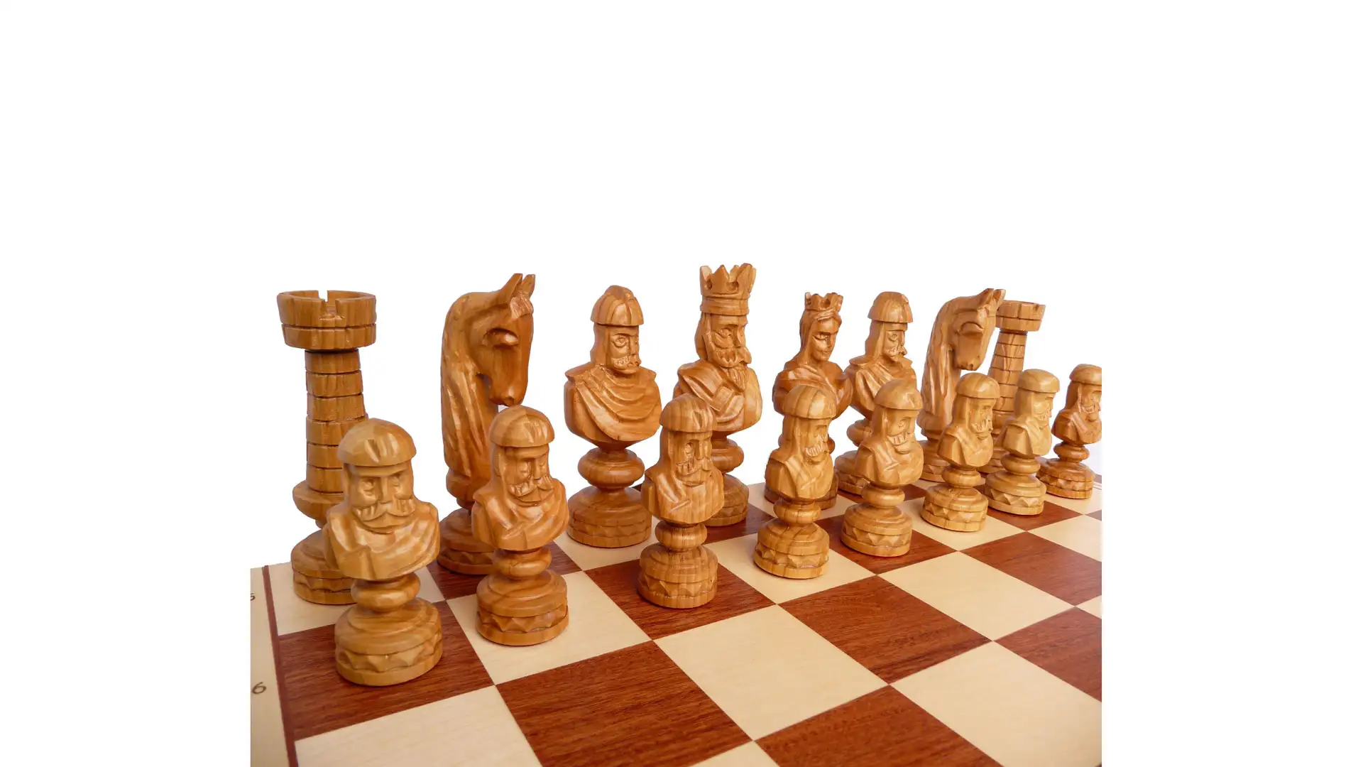 Hand-carved wooden chess pieces on a chessboard