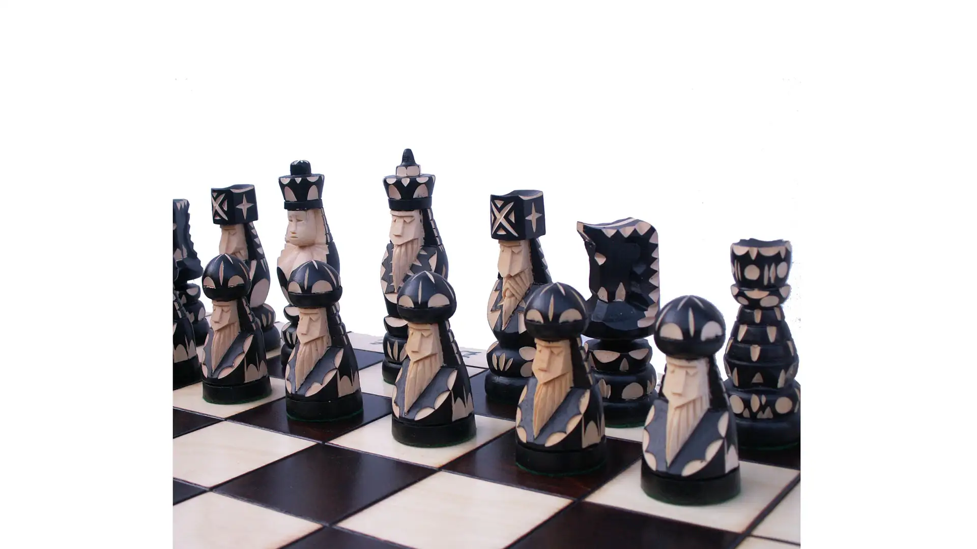 Artistic chess pieces in black and cream color scheme